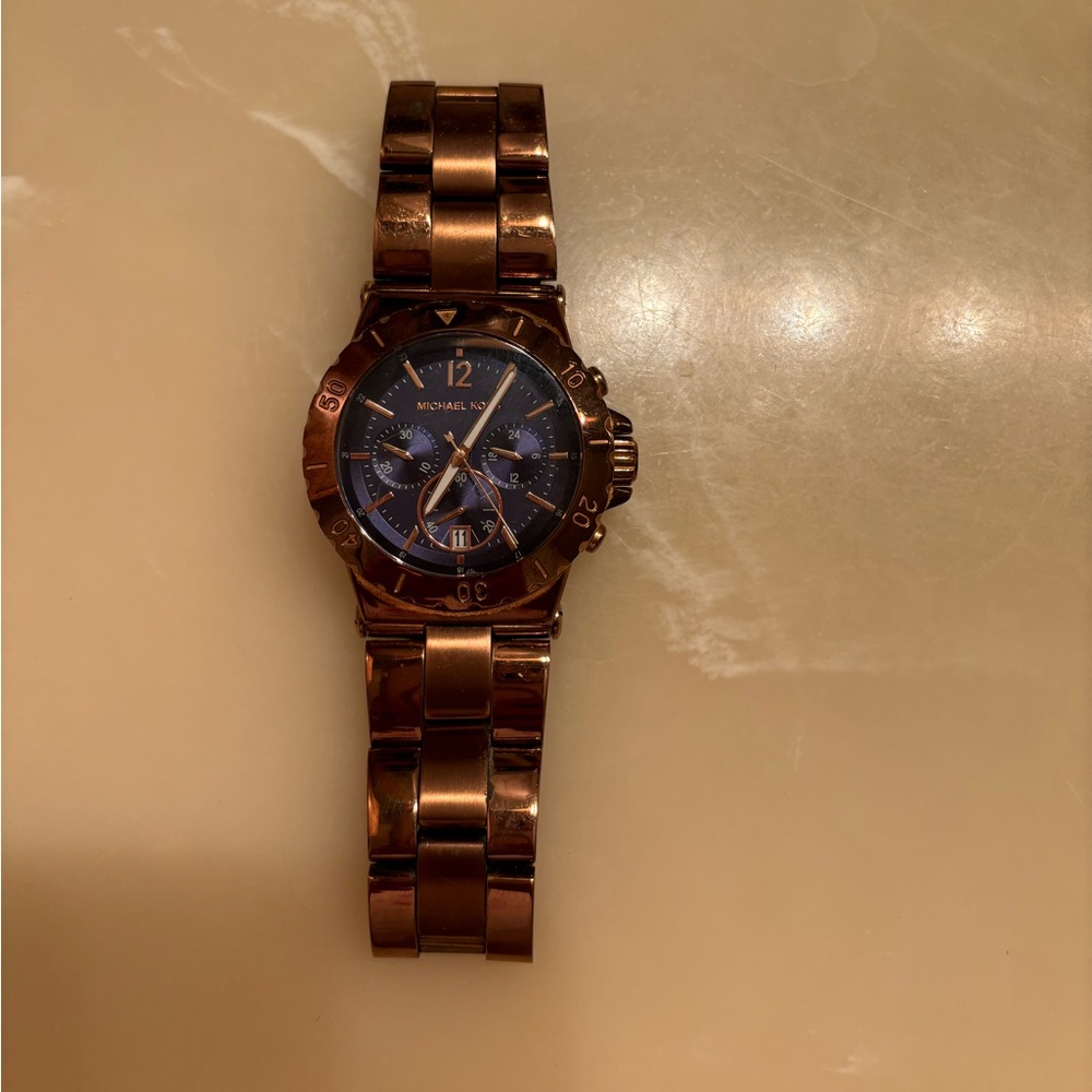 Excellent shape, rose gold, navy face Michael Kors watch.  Needs new battery.
